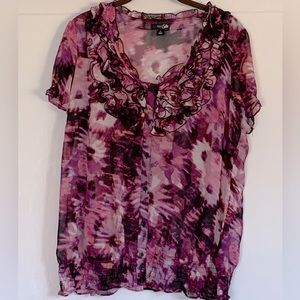 Dress blouse, short sleeves.  Ruffled collar, button down front, elastic hem.